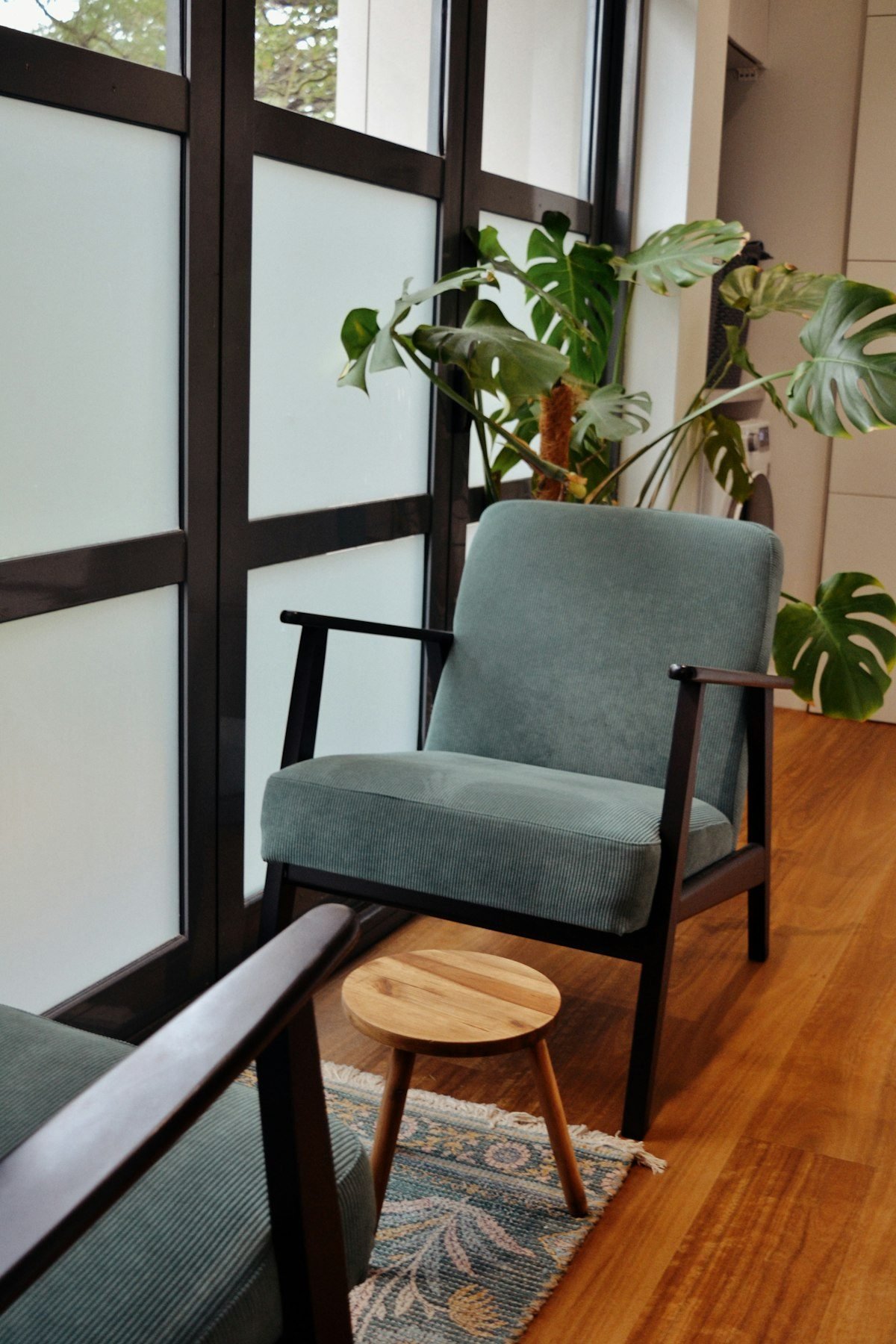A calm chair by a window, the kind of room a session happens in